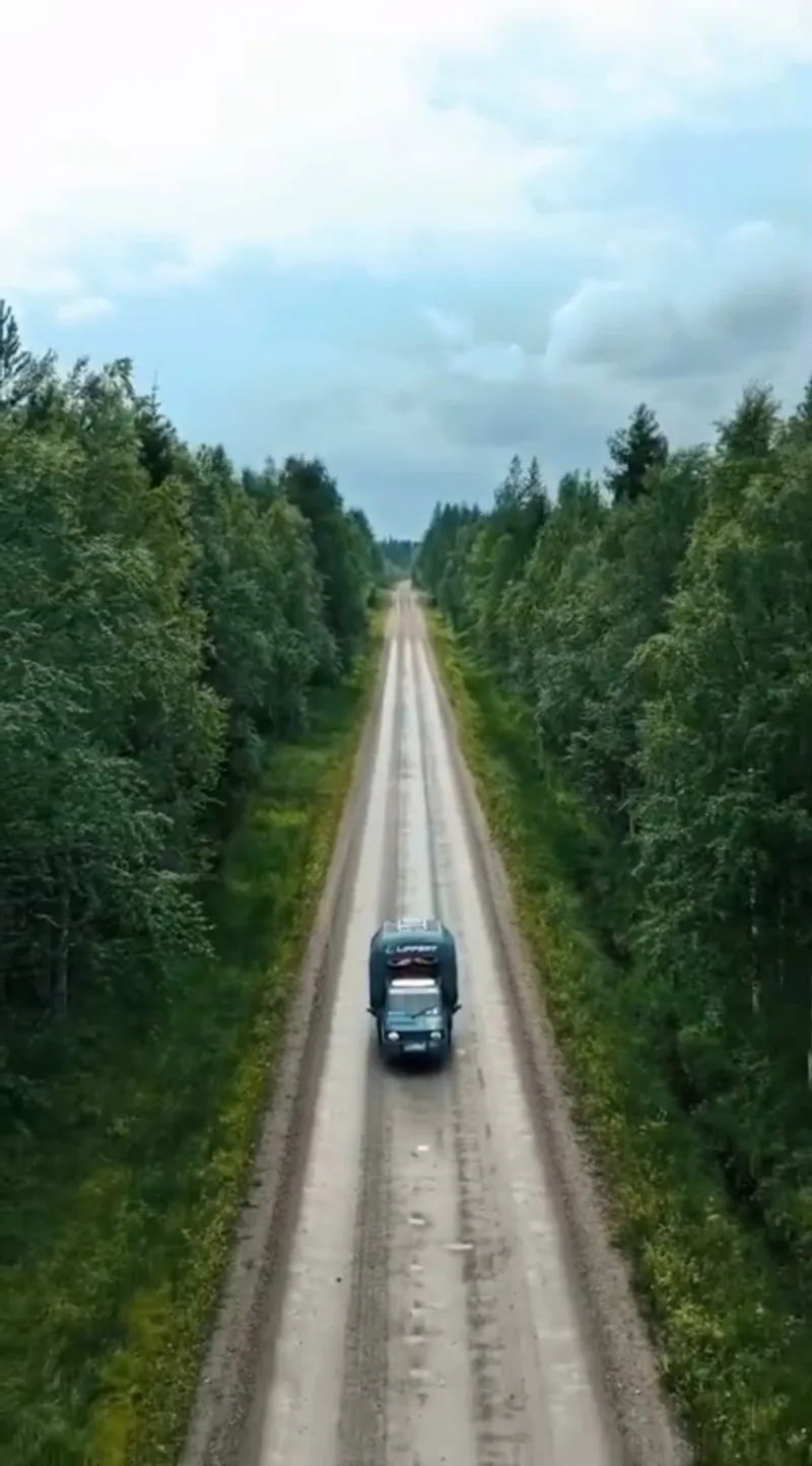 The Piaggio Ape on a road through the northern forests