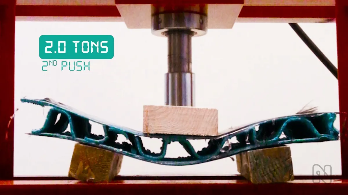 3D-printed sandwich panel under the hydraulic press at 2 tonnes