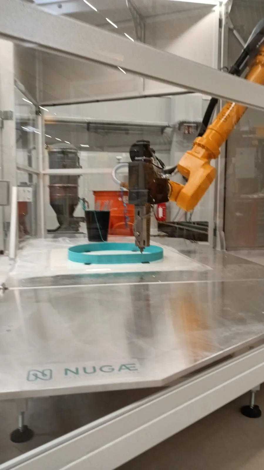 The NUGAE pellet extruder printing a component inside the Mobile Factory
