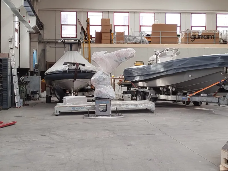 The NUGAE robot positioned among the boats under construction