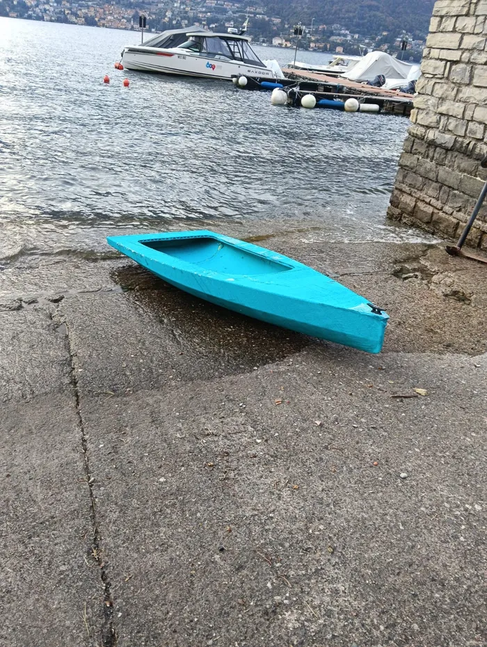 The hull seen from the side, with moored boats behind