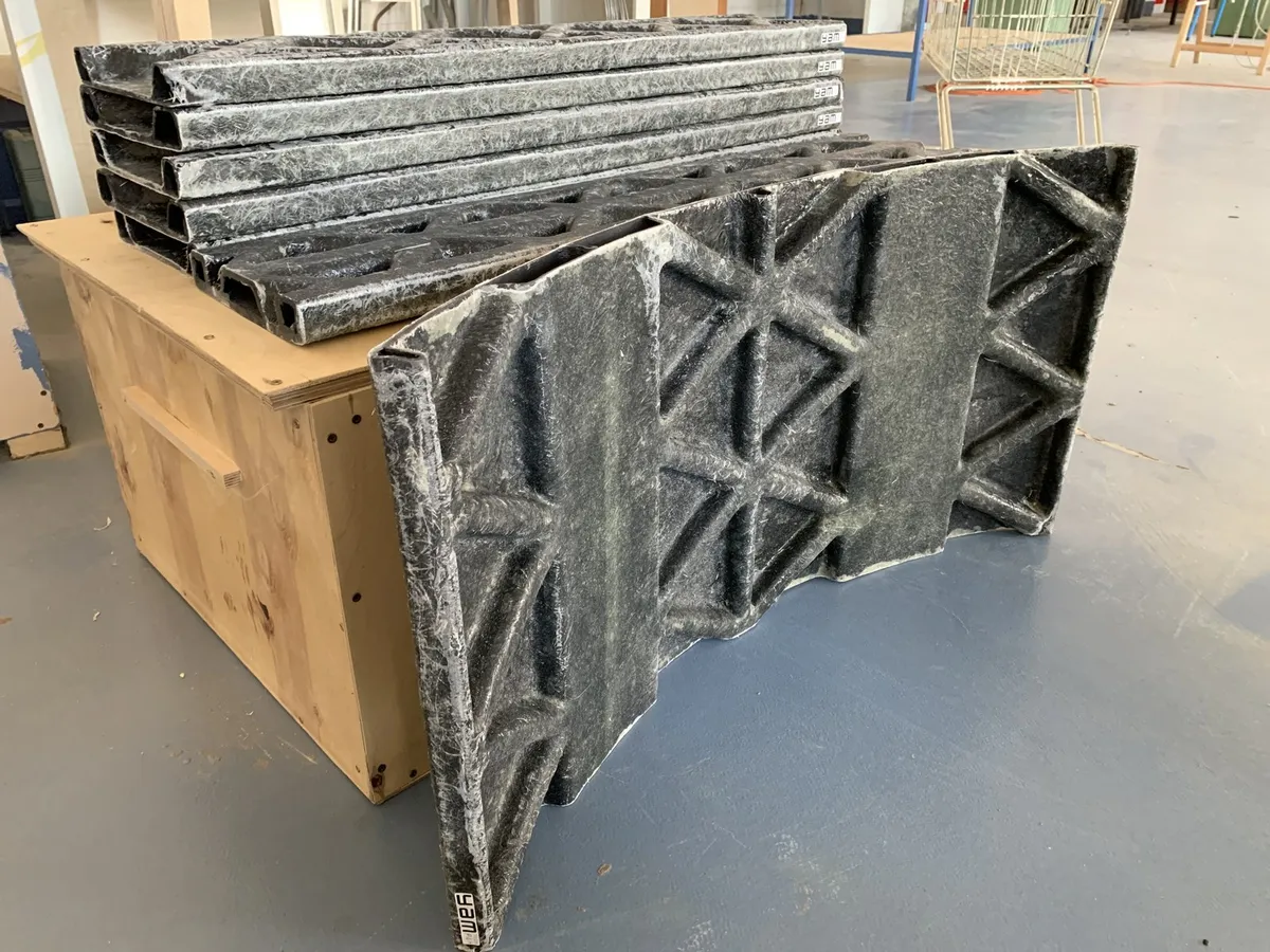 3D-printed rib-stiffened composite panels laminated with glass fibre